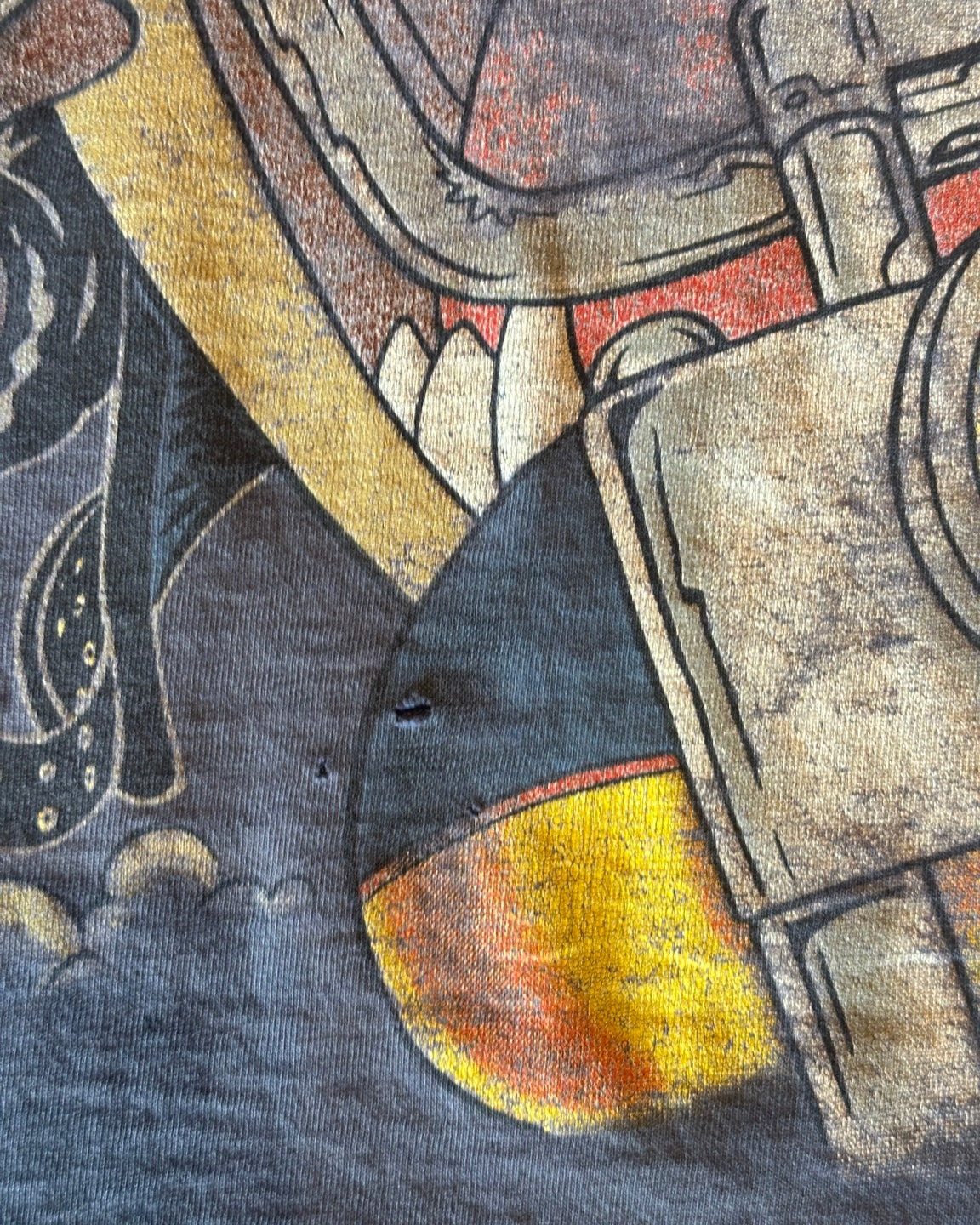 Close-up of holes near the front graphic