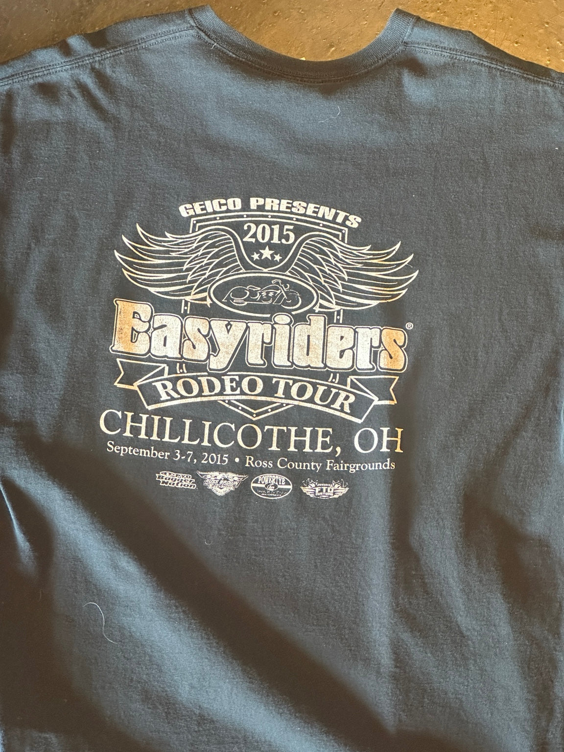 Back view of vintage black graphic T-shirt