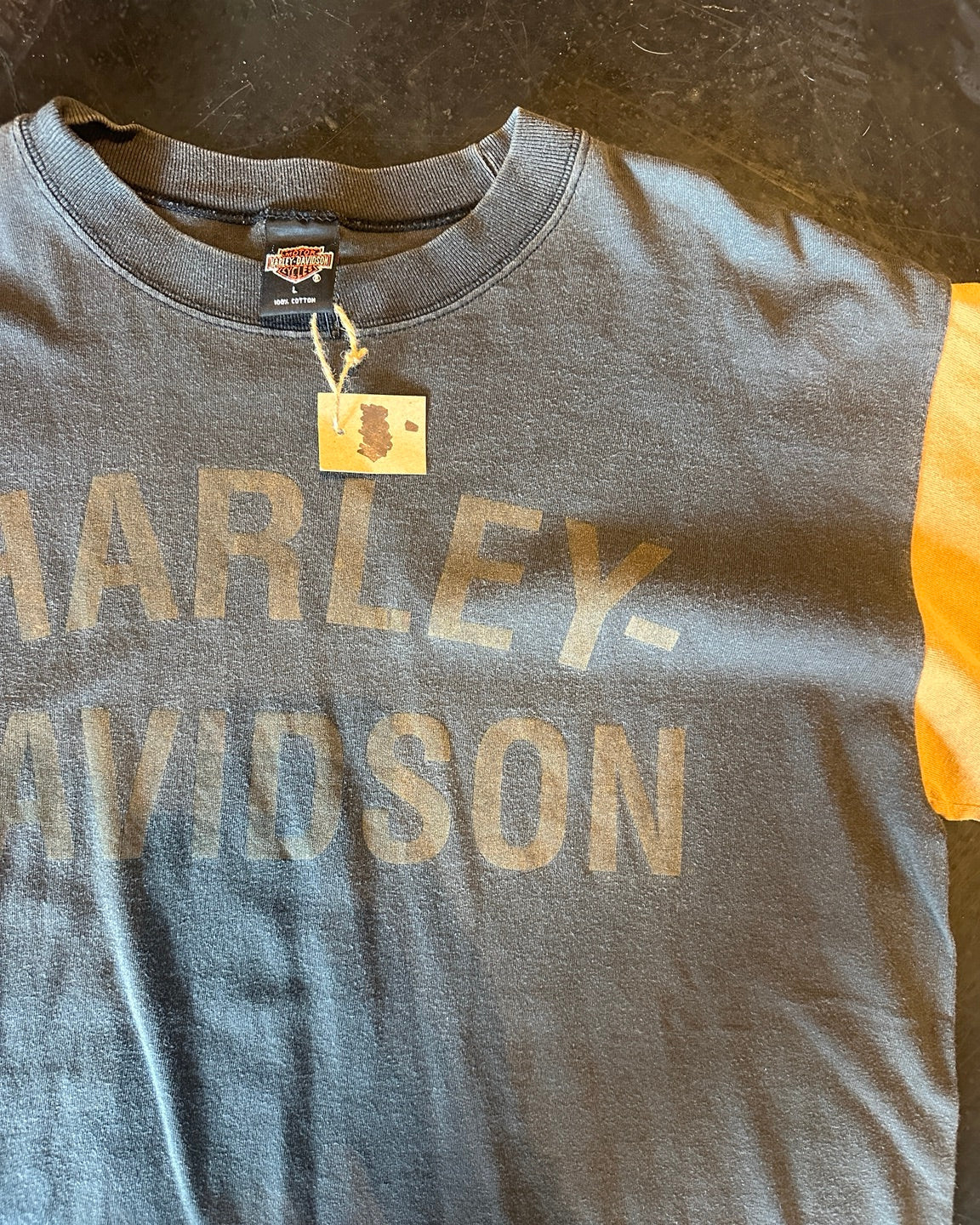Close-up of faded front logo