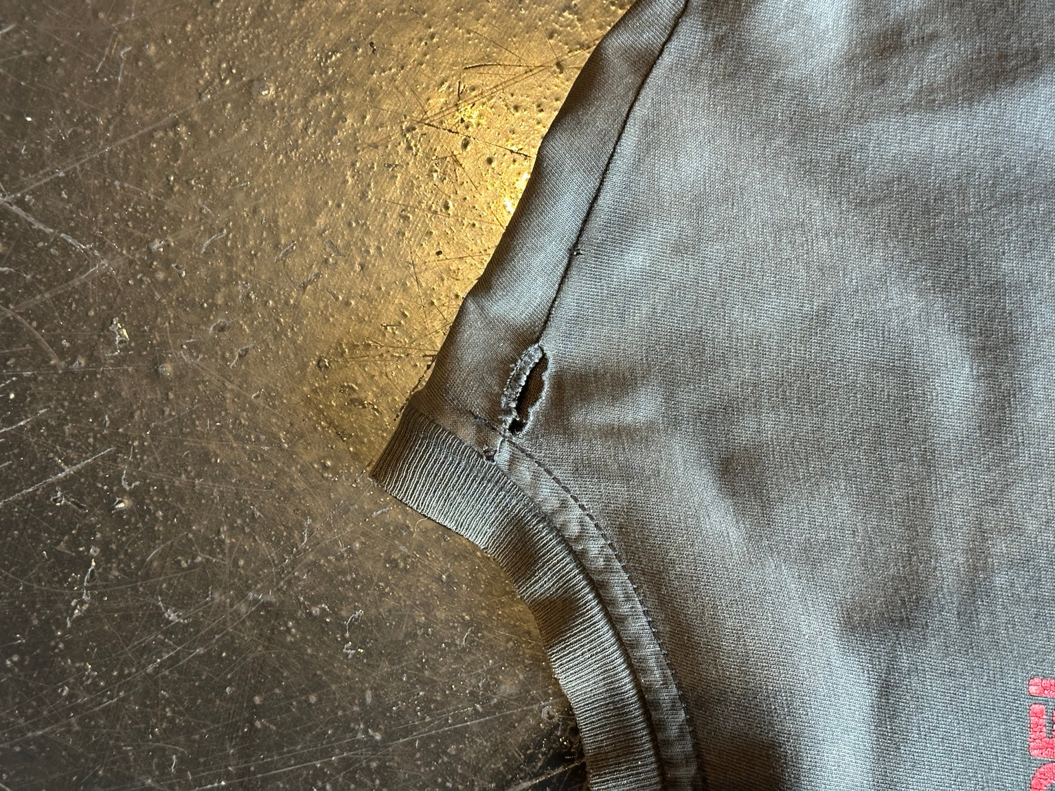 Vintage T-shirt shoulder hole detail